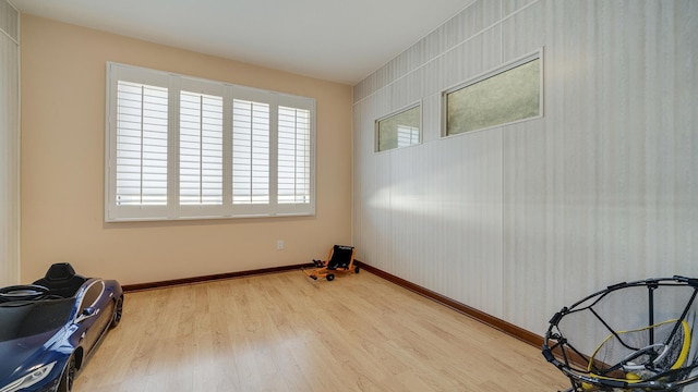 spare room with hardwood / wood-style floors