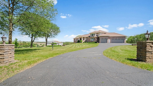 14481 Berglund Rd, Pecatonica, IL 61063 - mediterranean / spanish-style home with an attached garage, driveway, and a front yard
