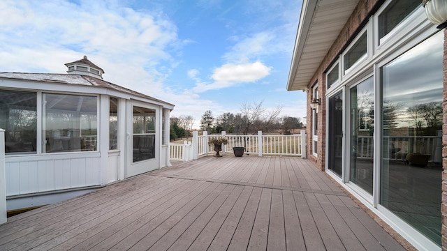 deck with a sunroom