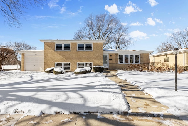 split level home with brick siding