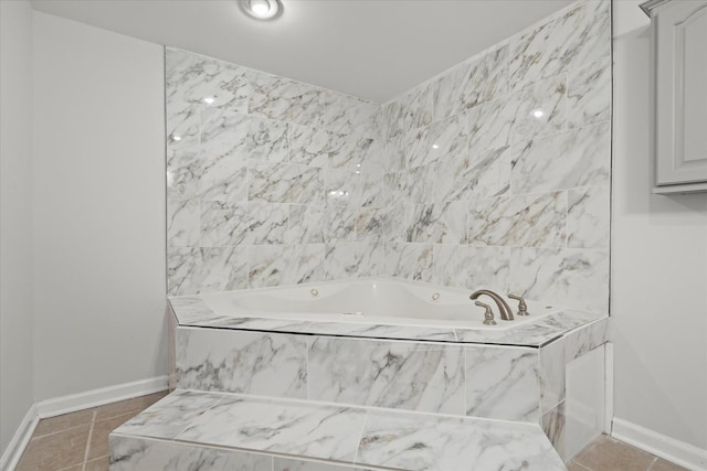 bathroom featuring tiled tub