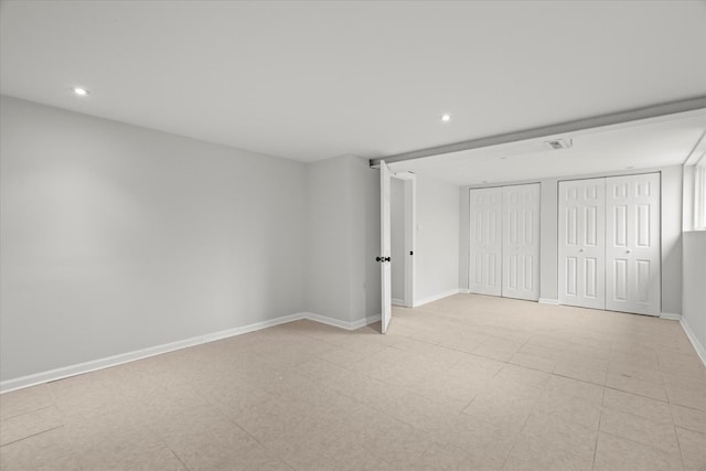 unfurnished bedroom with multiple closets