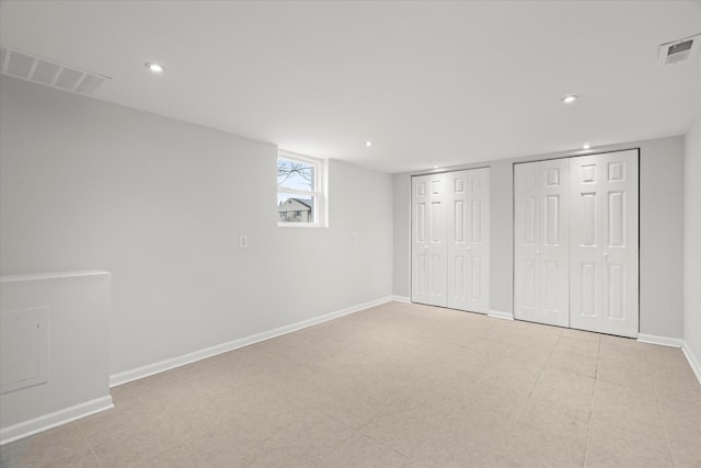 unfurnished bedroom with multiple closets