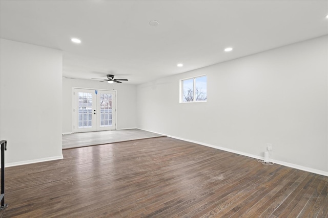 unfurnished room with ceiling fan, dark hardwood / wood-style flooring, and french doors