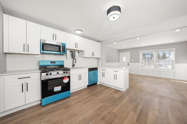 kitchen featuring white cabinetry, sink, and stainless steel appliances