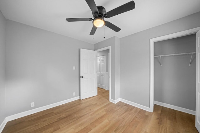 unfurnished bedroom with a closet, ceiling fan, and light wood-type flooring