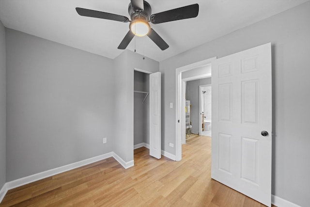 unfurnished bedroom with light hardwood / wood-style flooring, a closet, and ceiling fan