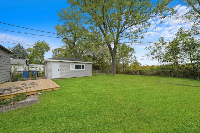 view of yard with an outdoor structure and a deck