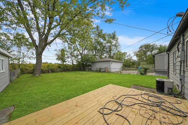 deck with a yard and central air condition unit