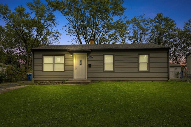 view of front of property with a yard