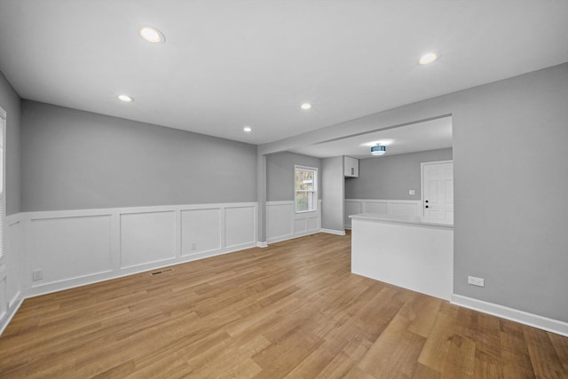 unfurnished living room featuring light hardwood / wood-style flooring