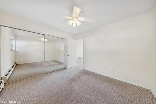 unfurnished bedroom with ceiling fan, a baseboard radiator, light colored carpet, and a closet