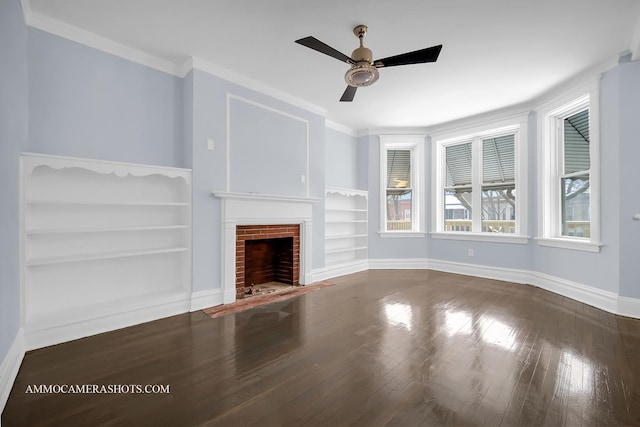 unfurnished living room with ceiling fan, ornamental molding, a fireplace, and built in shelves