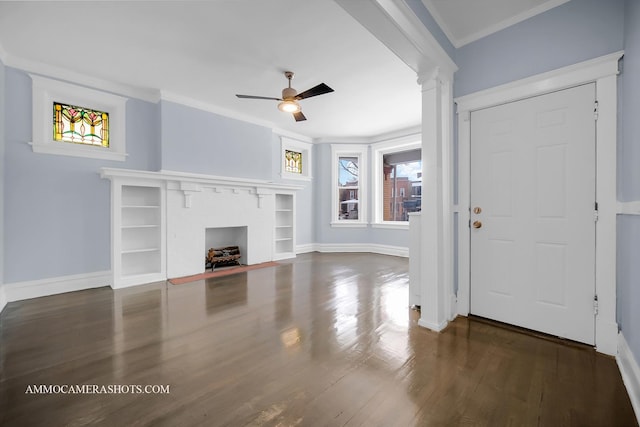 unfurnished living room featuring ceiling fan, crown molding, a fireplace, and dark hardwood / wood-style floors