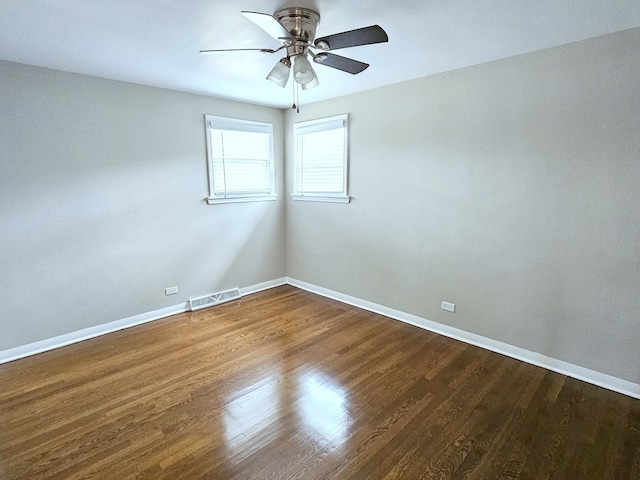 spare room with ceiling fan and wood-type flooring