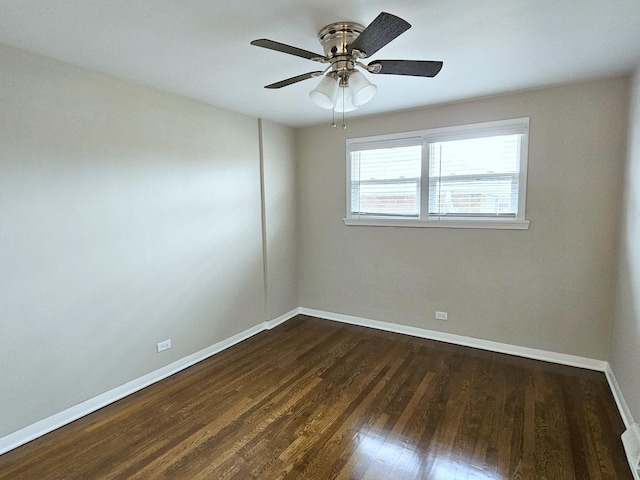 unfurnished room featuring ceiling fan and dark hardwood / wood-style floors