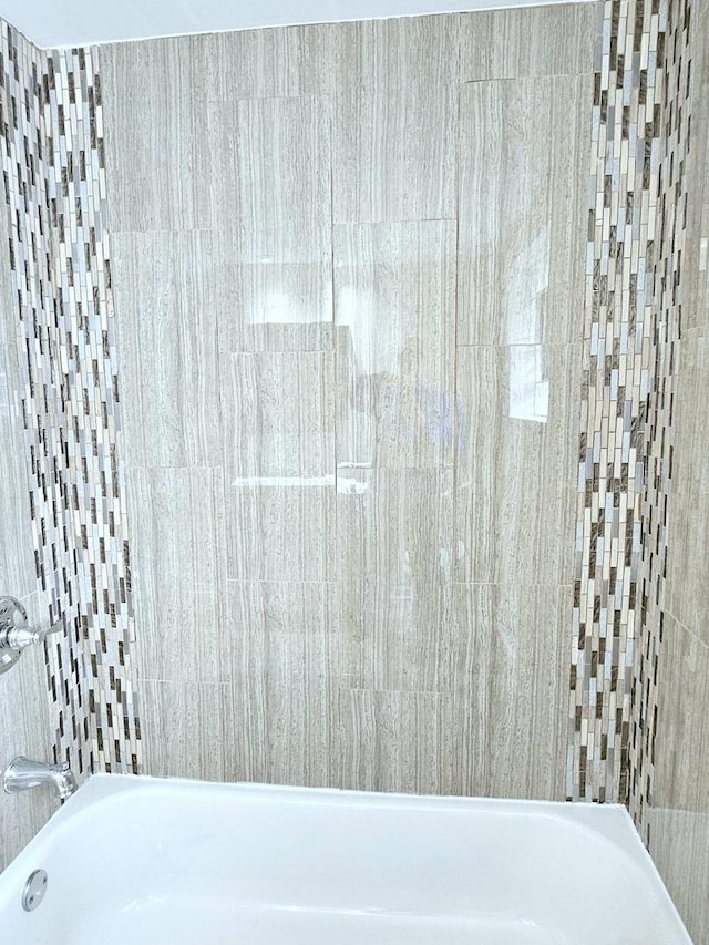 bathroom with shower / bath combination