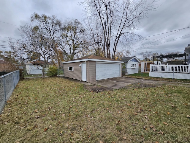 view of yard featuring a pergola, a garage, and an outdoor structure