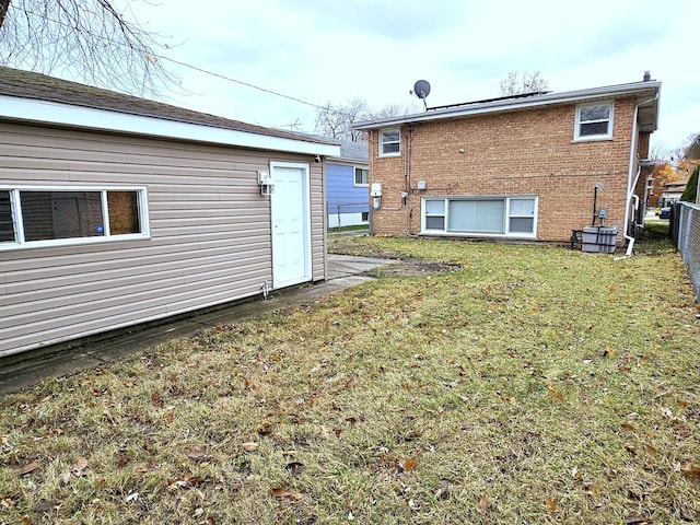 rear view of house with a yard