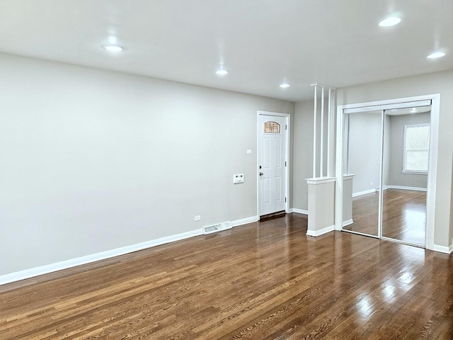 interior space with dark hardwood / wood-style flooring