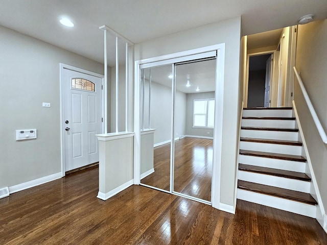 entrance foyer with dark hardwood / wood-style floors