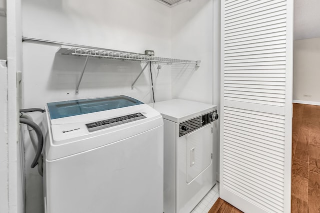 laundry area with independent washer and dryer