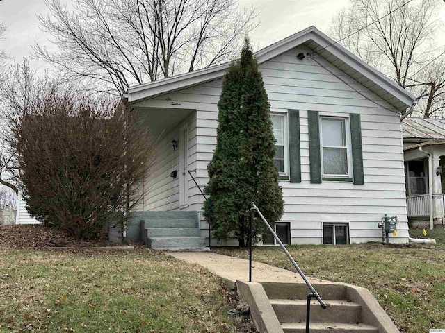 view of home's exterior with a yard