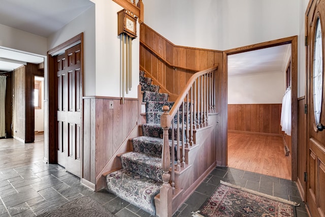 stairway with wood walls