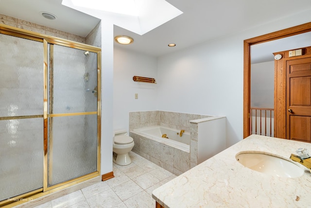 full bathroom with toilet, vanity, a skylight, and shower with separate bathtub