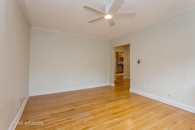 empty room with ceiling fan, light wood-type flooring, and ornamental molding