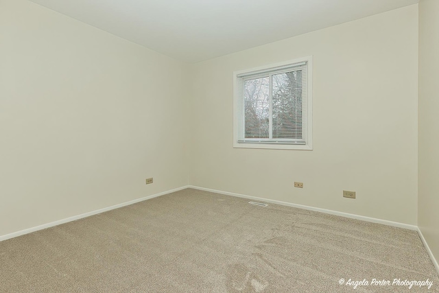 spare room featuring carpet floors