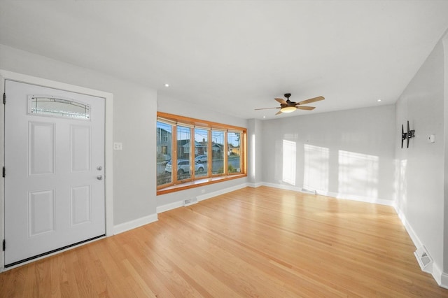 foyer entrance featuring ceiling fan and light hardwood / wood-style floors