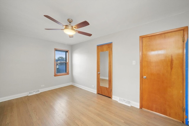 unfurnished bedroom featuring light wood-type flooring and ceiling fan