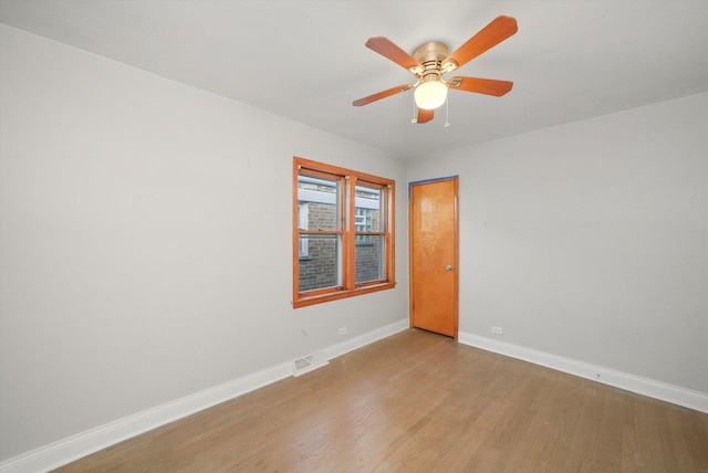 empty room featuring ceiling fan and light wood-type flooring