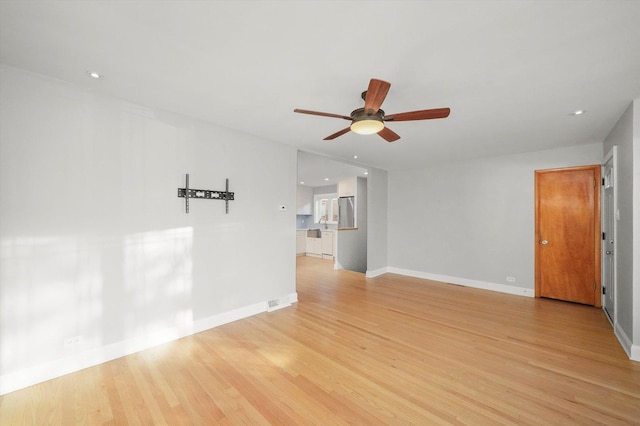 unfurnished room with light hardwood / wood-style floors and ceiling fan