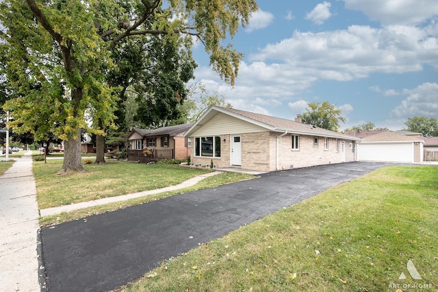 ranch-style home with a garage and a front lawn