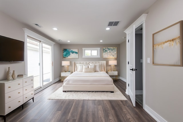 bedroom with access to exterior and dark hardwood / wood-style floors