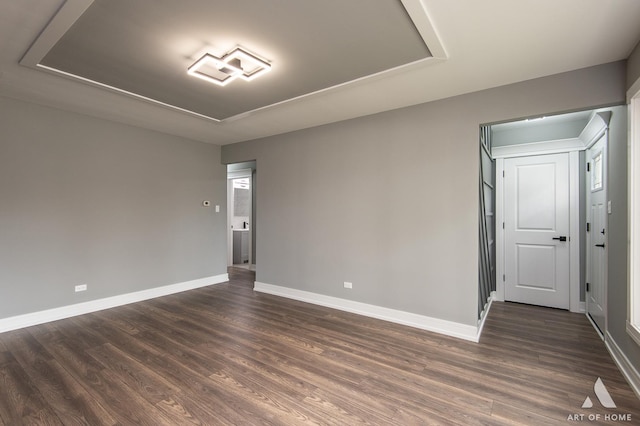 empty room featuring dark wood-type flooring