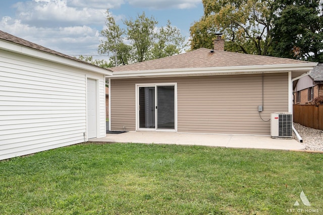 back of house with a patio area, cooling unit, and a lawn