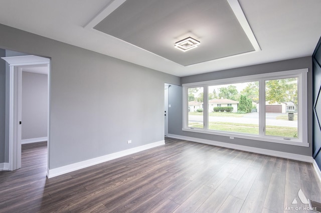 empty room featuring dark hardwood / wood-style flooring