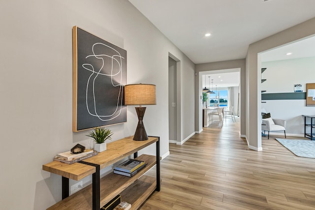 hallway with light wood-type flooring