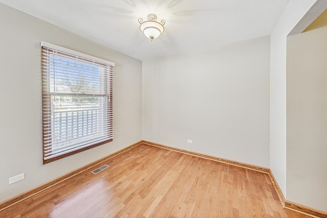 unfurnished room featuring light hardwood / wood-style flooring