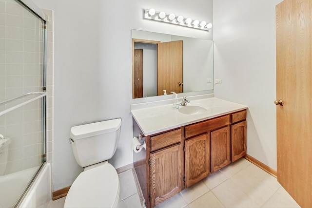 full bathroom featuring vanity, tile patterned floors, shower / bath combination with glass door, and toilet