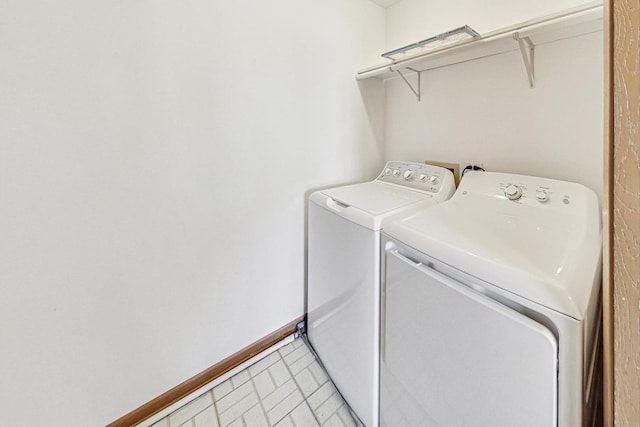 laundry area with washing machine and dryer