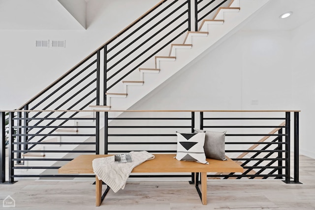 stairway featuring hardwood / wood-style floors