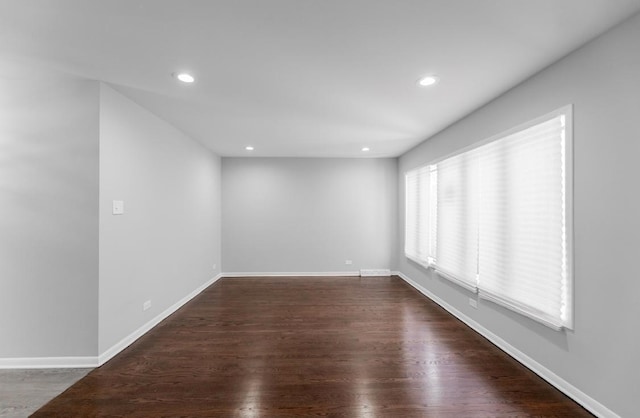 empty room with dark hardwood / wood-style floors