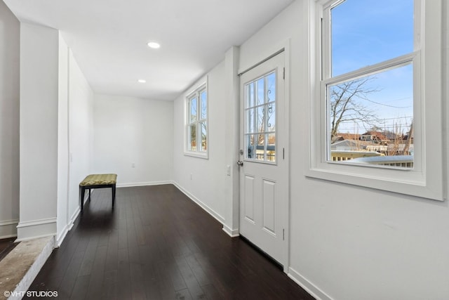 doorway featuring dark wood-type flooring