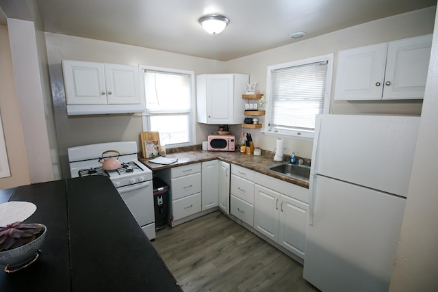 kitchen featuring dark hardwood / wood-style flooring, sink, white cabinets, and white appliances