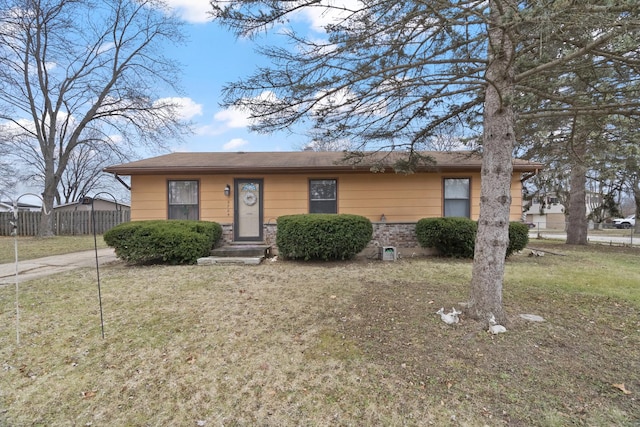 ranch-style home with a front lawn