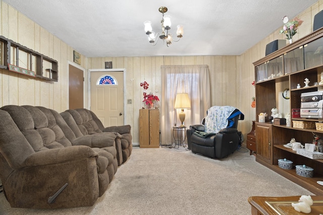 living room featuring carpet and a notable chandelier